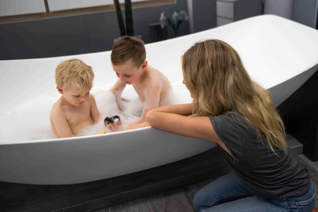 children bathing in The Hammock Bath scaled